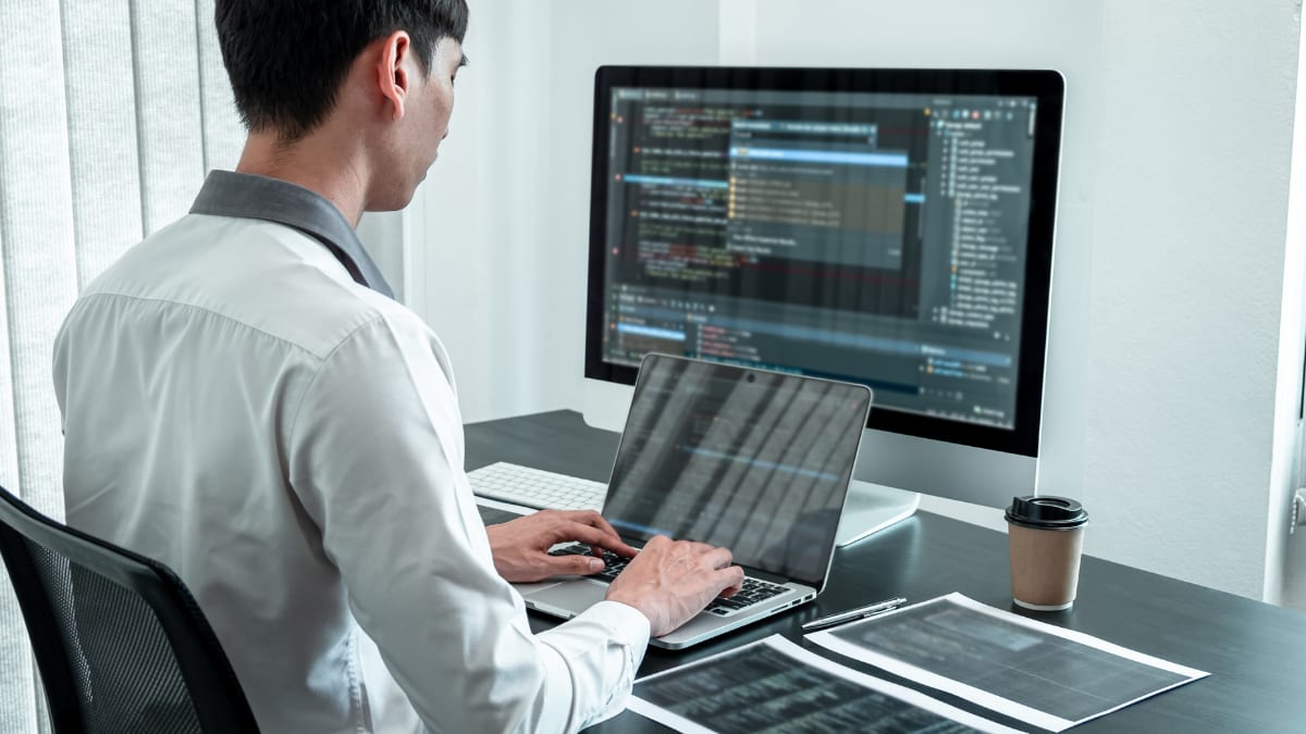 cyber security professional working on a laptop