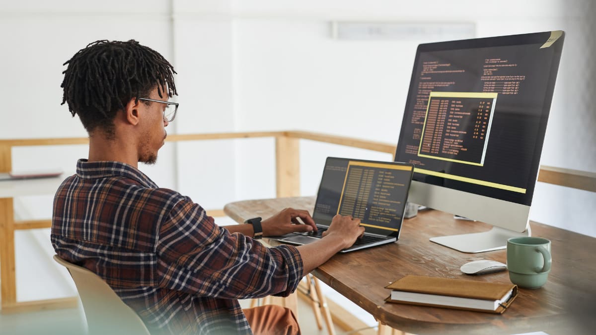 cyber security professional working on a laptop