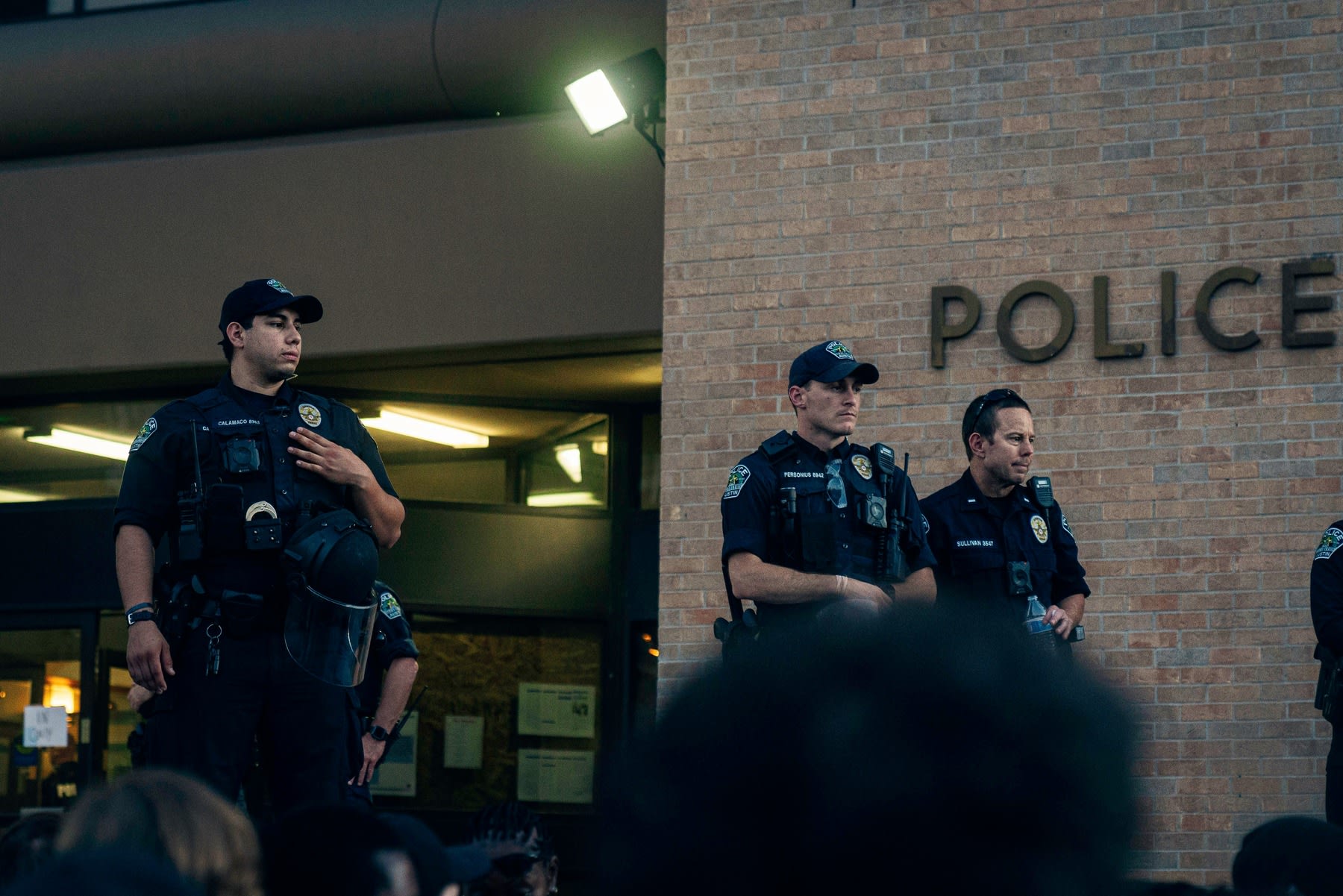 Police officers overseeing a crowd during a crowd demonstration
