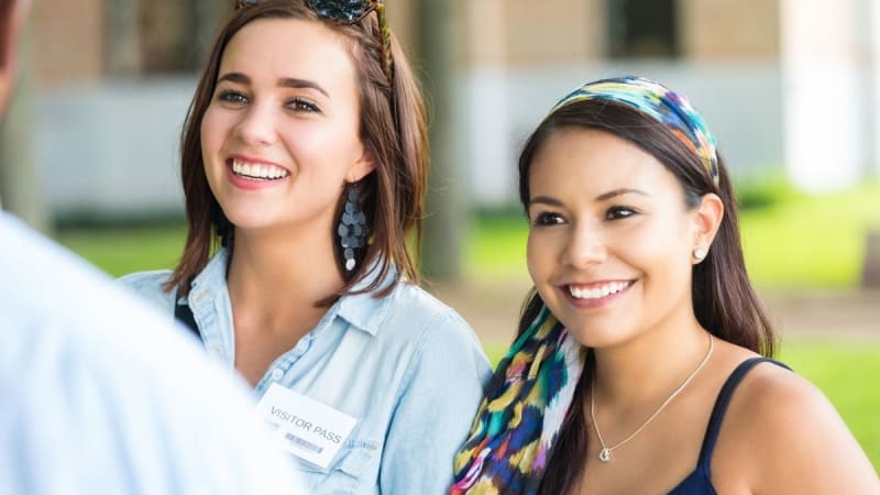 Two women smiling outside