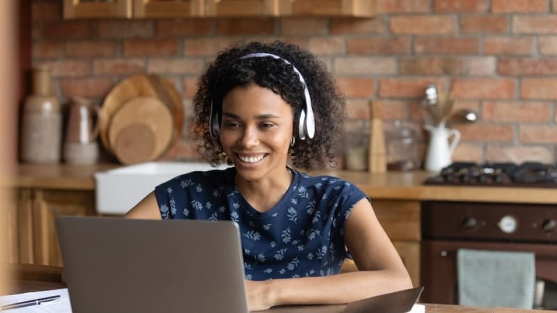 Happy woman on a laptop